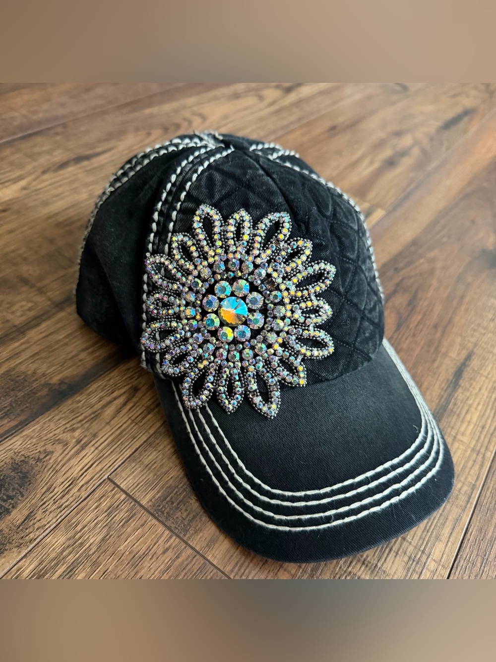 Black Quilted Baseball Cap with Iridescent Crystal Floral Accent